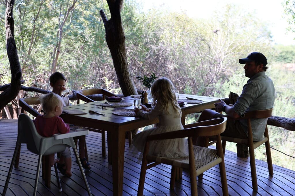 Deck view from Madikwe suite with grazing zebras in the background