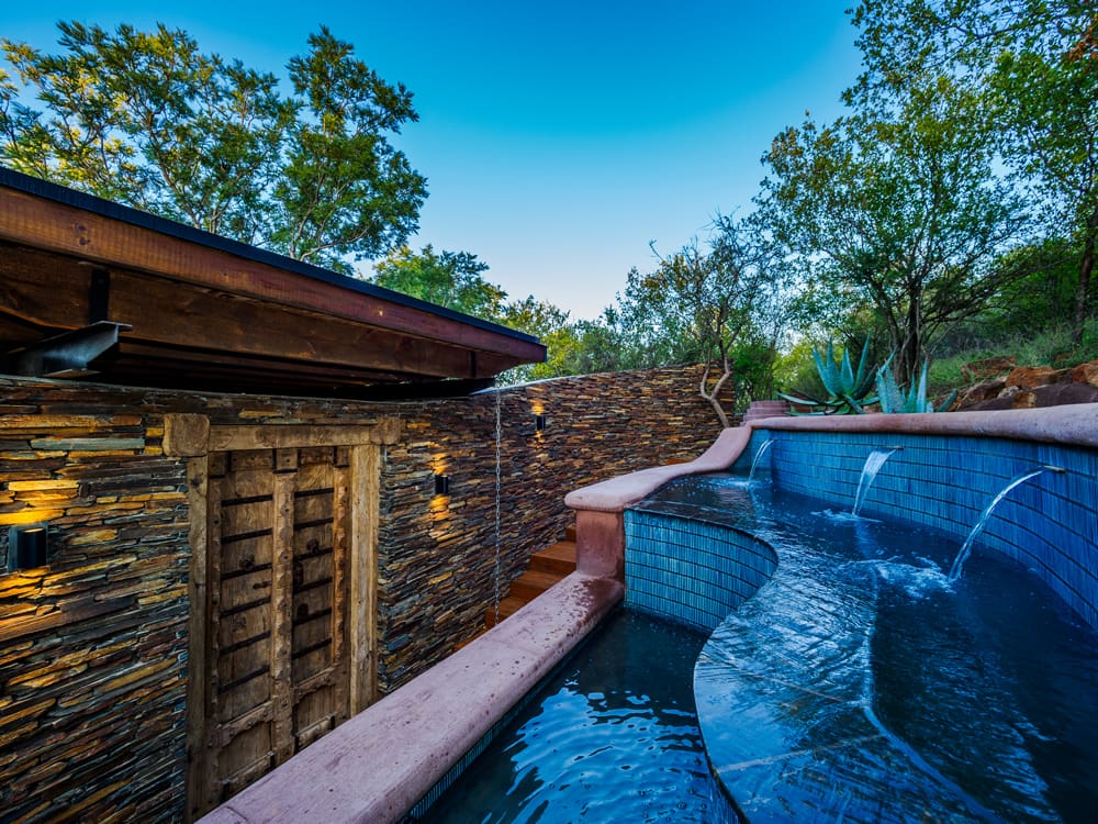 Family enjoying dinner at Madikwe Safari Lodge, South Africa